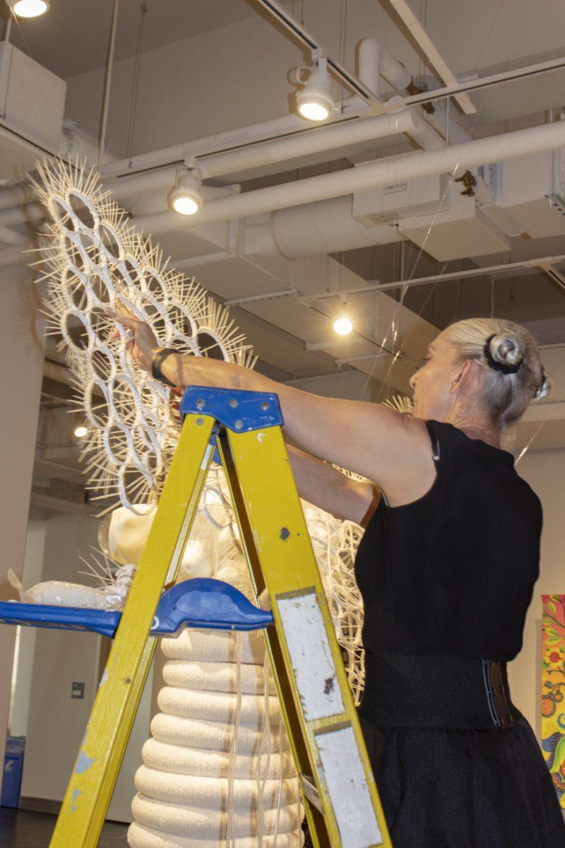 Heather Ujiee works on one of her sculptures at the Rowan University Art Gallery. - Arts & Entertainment Editor/Tara Lonsdorf