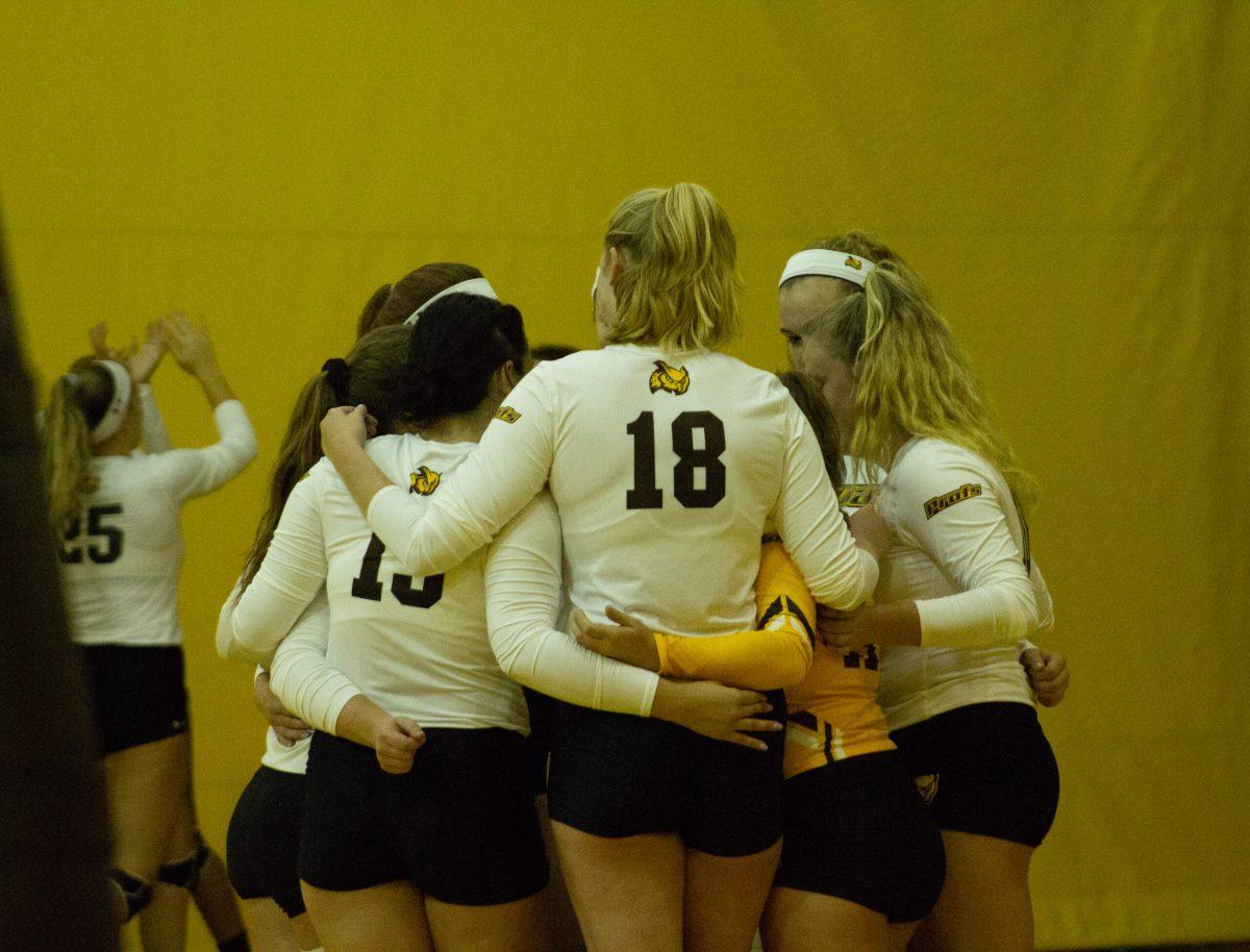 The volleyball team huddle up before heading to action at the Profs Invitational. The team went 4-0 on the weekend. Staff Photographer/Ray Baldassari