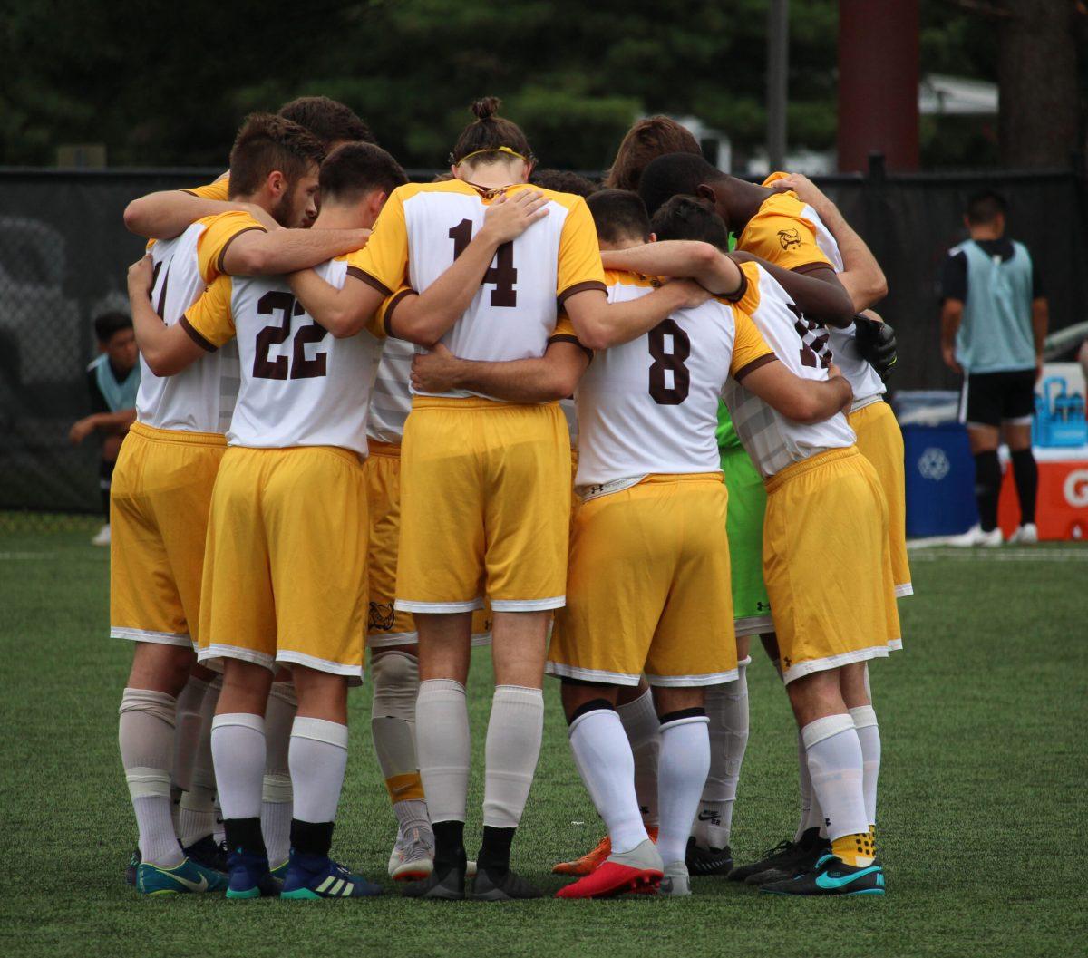 The Rowan men's soccer team huddle during a game earlier this season. They lost 4-3 to Montclair State University in the NJAC Championship Tournament Semi-Finals. Multimedia Editor/Jaryd Leady