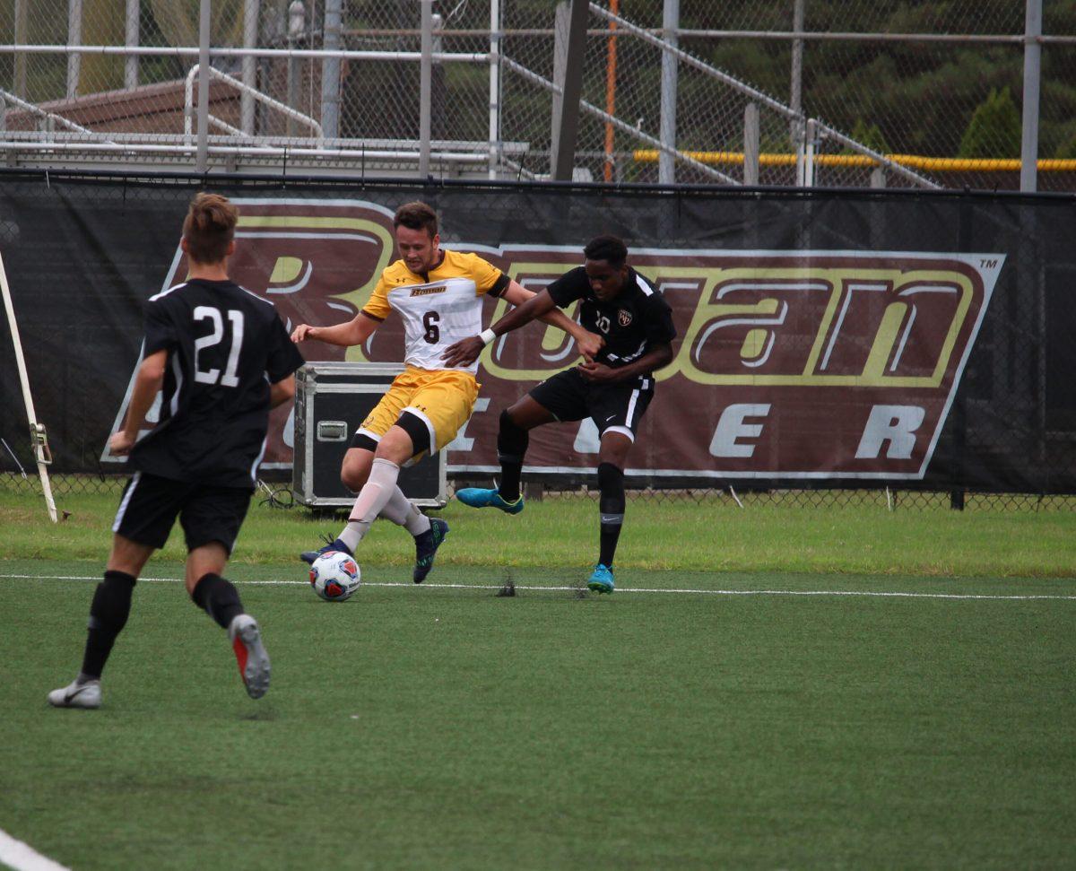 Rowan senior back Will Sjaastad fights for possession against William Paterson on September 15. Multimedia Editor/Miguel Martinez