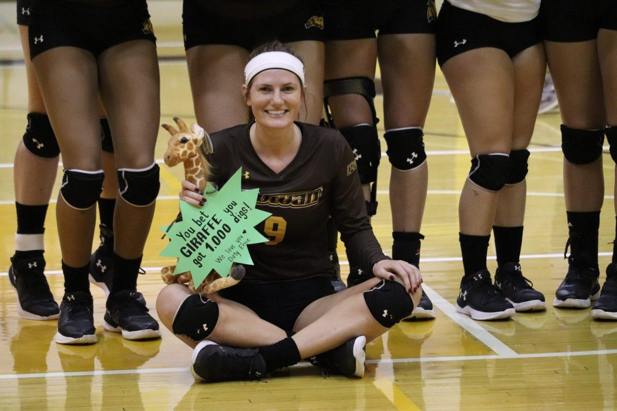 Erin Keegan, senior outside hitter for Rowan University celebrates her 1000th career dig with her teammates and coaches on Saturday, October 6, 2018 - Multimedia Editor/Jaryd Leady