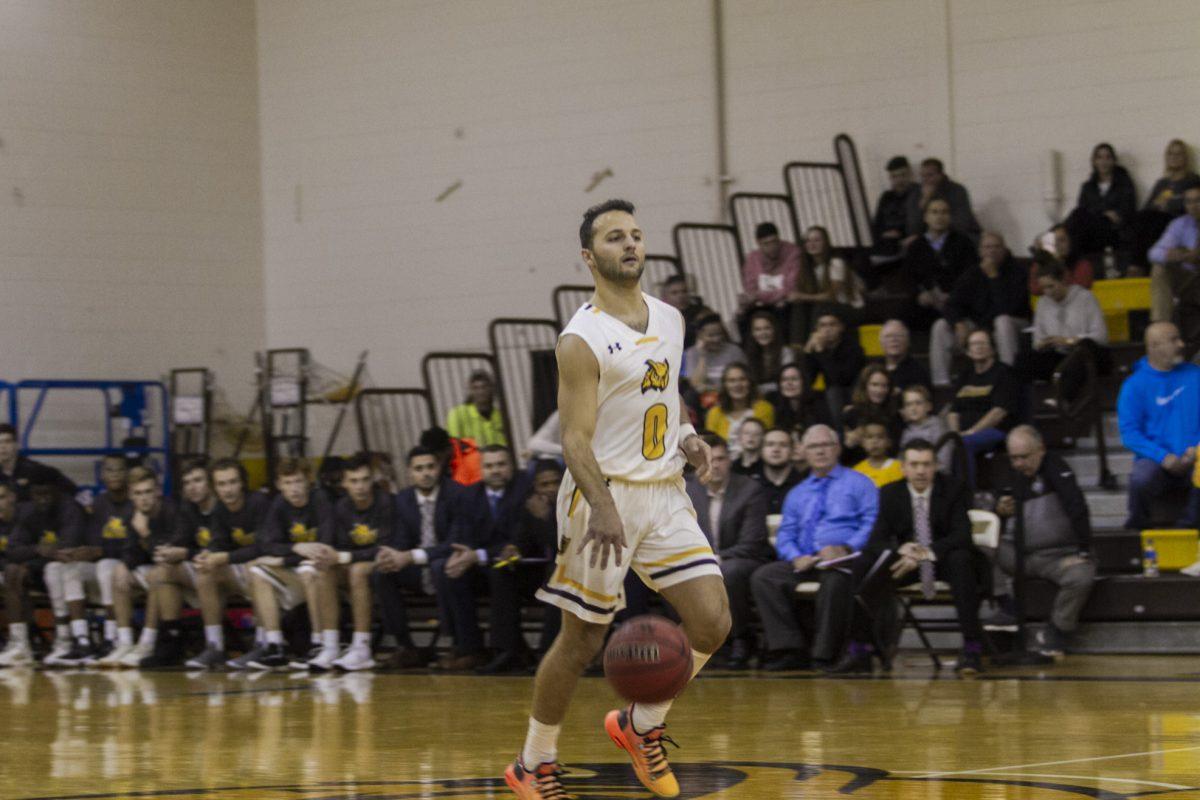 Senior guard Rob DePersia brings the ball up at the LaScala's Fire Tip-Off Tournament. Multimedia Editor/Miguel Martinez