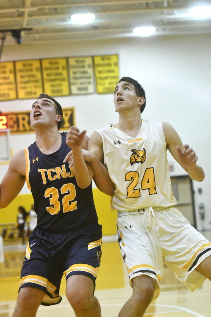 Marko Pantovic goes against an TCNJ player for a rebound last Wednesday. Photo courtesy of Sports Information.