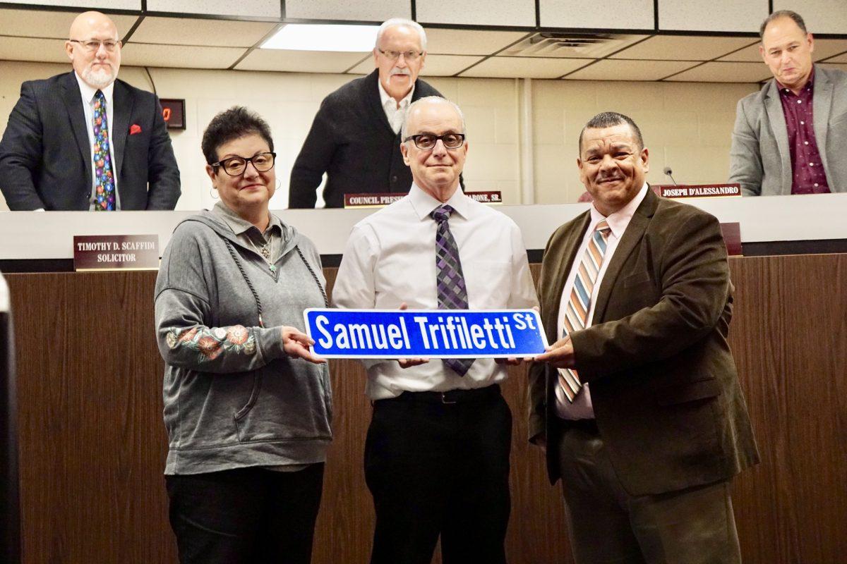 Carmen Trifiletti and Mayor John E Wallace III holding up the new Trifiletti st. sign. -Photo courtesy of The Borough of Glassboro