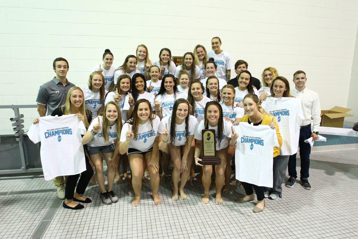 The Rowan women's swimming and diving team celebrate their third NJAC title in a row with a win over The College of New Jersey. -Photo courtesy of Rowan Athletics.