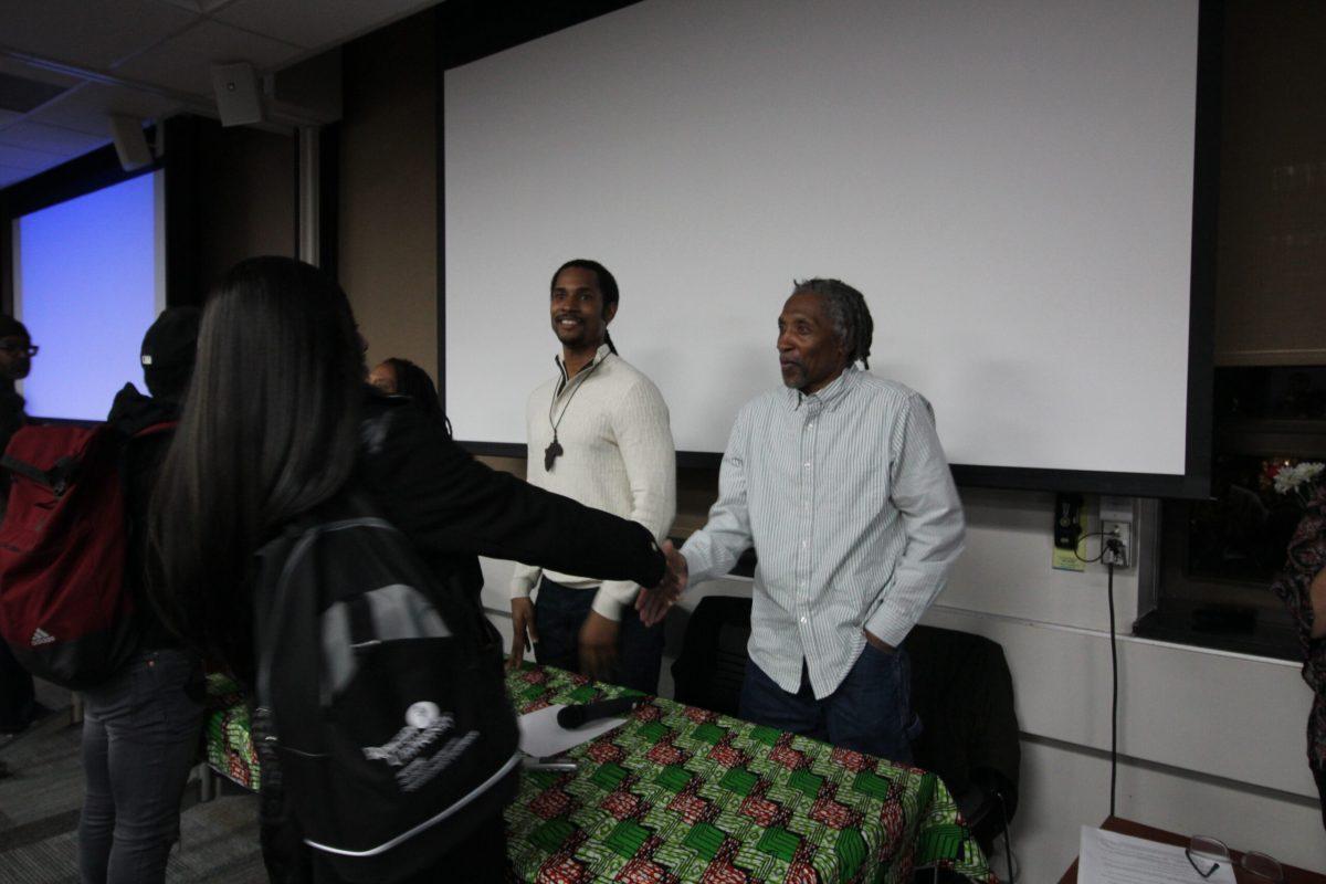 Mike Africa Jr. and Mike Africa Sr. taking to stage during the Relentless Hearts: A Story of Time, Love & Perseverance. -Vince Ceraso/Assistant Features Editor