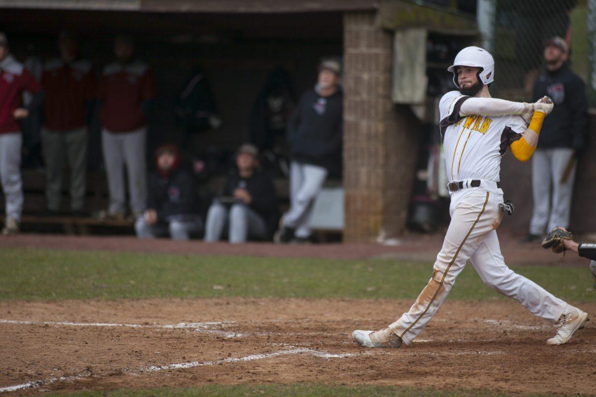 Senior Dillon Mendel takes a hack at a pitch in a game last season. Multimedia Editor/Miguel Martinez