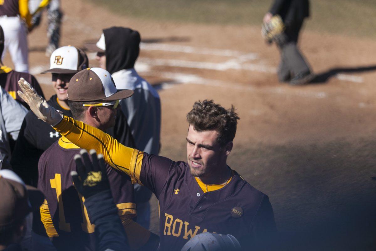 Senior Anthony Harrold walks back into the dugout in a game last year. Harrold was first on the team in runs, home runs, slugging percentage (.568) and on-base percentage, runs, home runs, slugging percentage and on-base percentage last season. Multimedia Editor/Miguel Martinez.