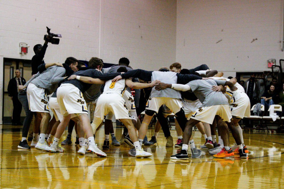 The Rowan men's basketball team huddles before its first game against Emerson in the NCAA Division III Championship Tournament. Staff Photographer/ Jason Fisch