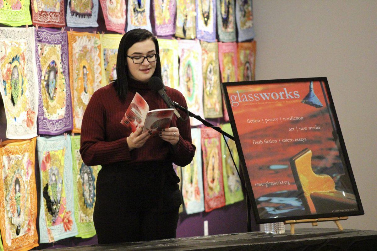 Writing arts senior Kaitlyn Gaffney reads from the Glassworks magazine. - Contributor Justina Addice