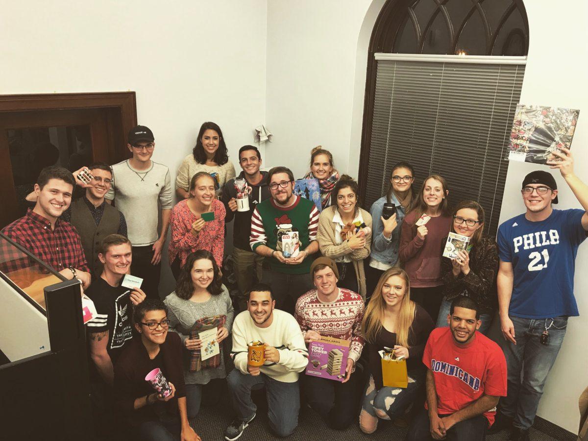 Multi-generational Whit staff members pose for a Christmas party portrait. -Courtesy of Sydney Kerelo's Facebook page