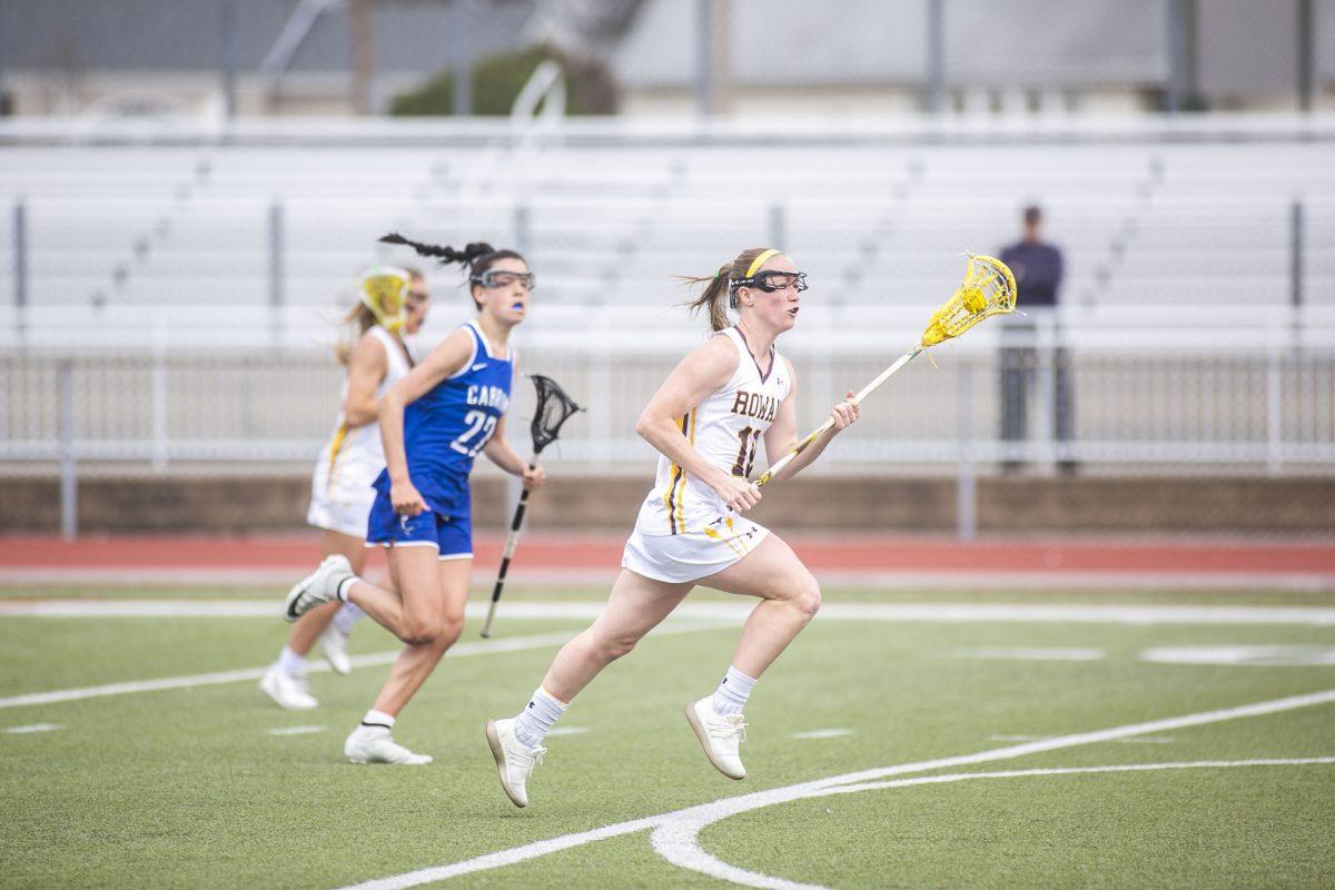 Rowan senior defender/midfielder and captain Taylor Gretz advances the ball against the University of Scranton on April 2, 2019. Multimedia Editor/Miguel Martinez.