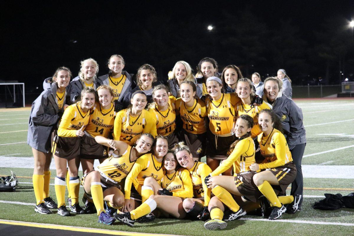 The field hockey team celebrates a win last season. - Photo / Multimedia Editor Dyone Payne