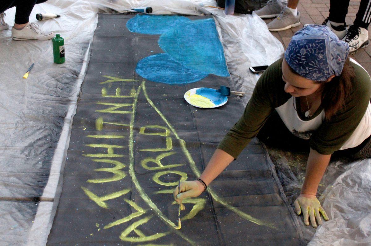 Homecoming teams get the chance to express their creativity in the Banner Competition. Whitney Center residents and RAs let their creativity shine through in their banner design. - Contributor / Kristin Guglietti