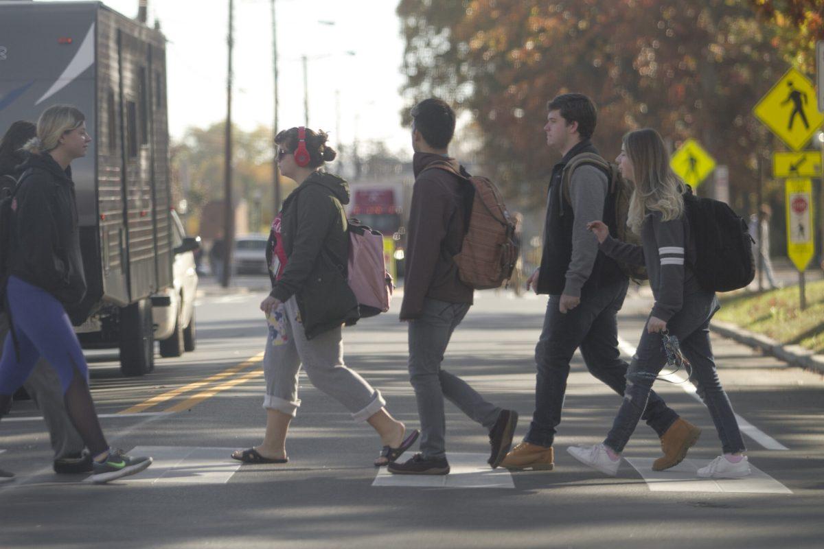 Students cross Route 322 in Glassboro, NJ during a fall day. - Editor-in-Chief / Miguel Martinez