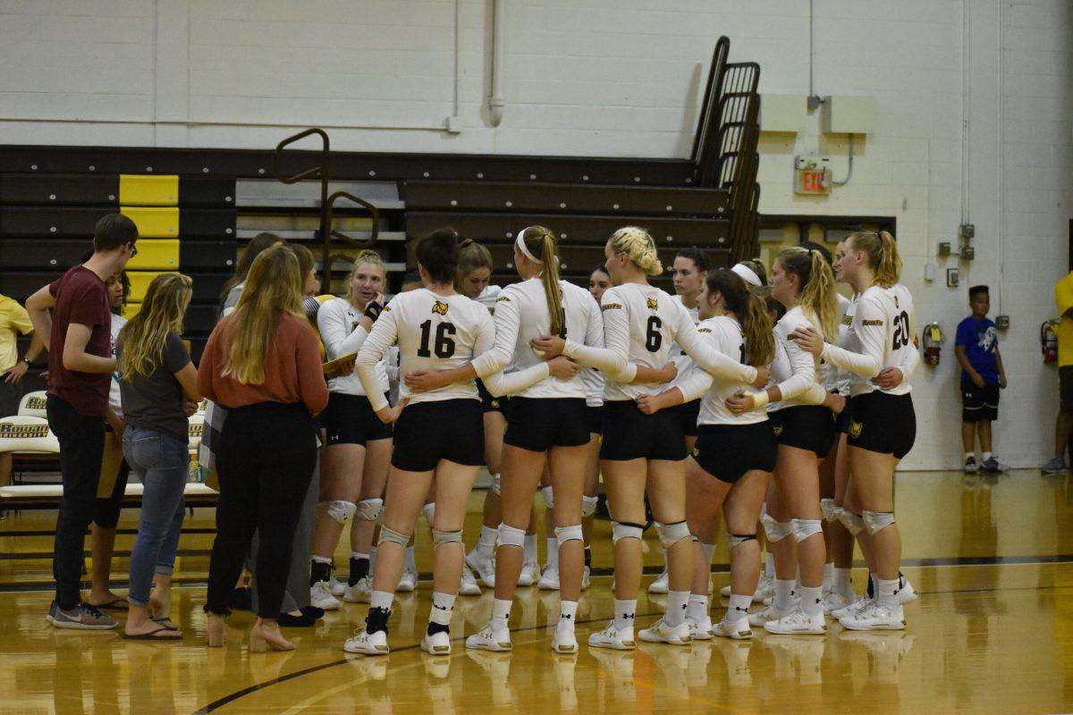 The volleyball team huddles during a game in 2019. Photo/ Multimedia Editor Christian Browne