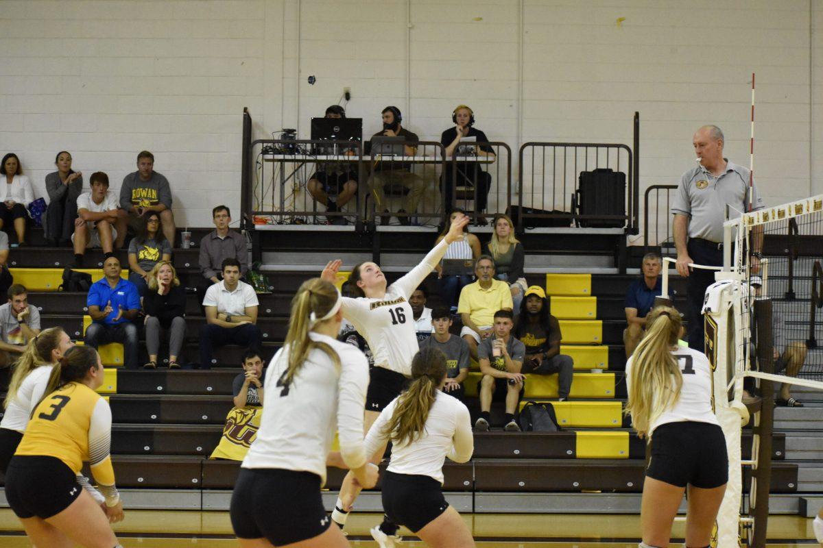 Megan Jacobi, center, gets ready to hit the ball in a game earlier this year. Photo / Multimedia Editor Christian A Browne. 