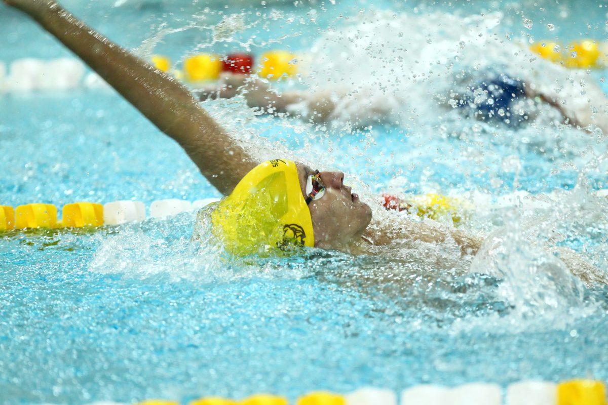 Kevin Gillooly swims backstroke last season. Photo/ Rowan Athletics.