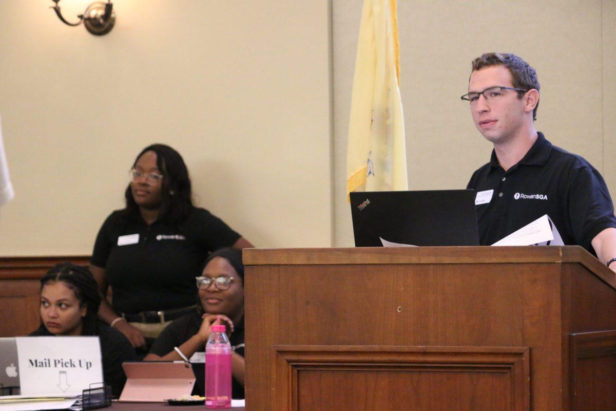 Kevin McCarthy speaking during an SGA Senate meeting with SGA President Arielle Gedeon in the background - Photo via / Alexander Heller