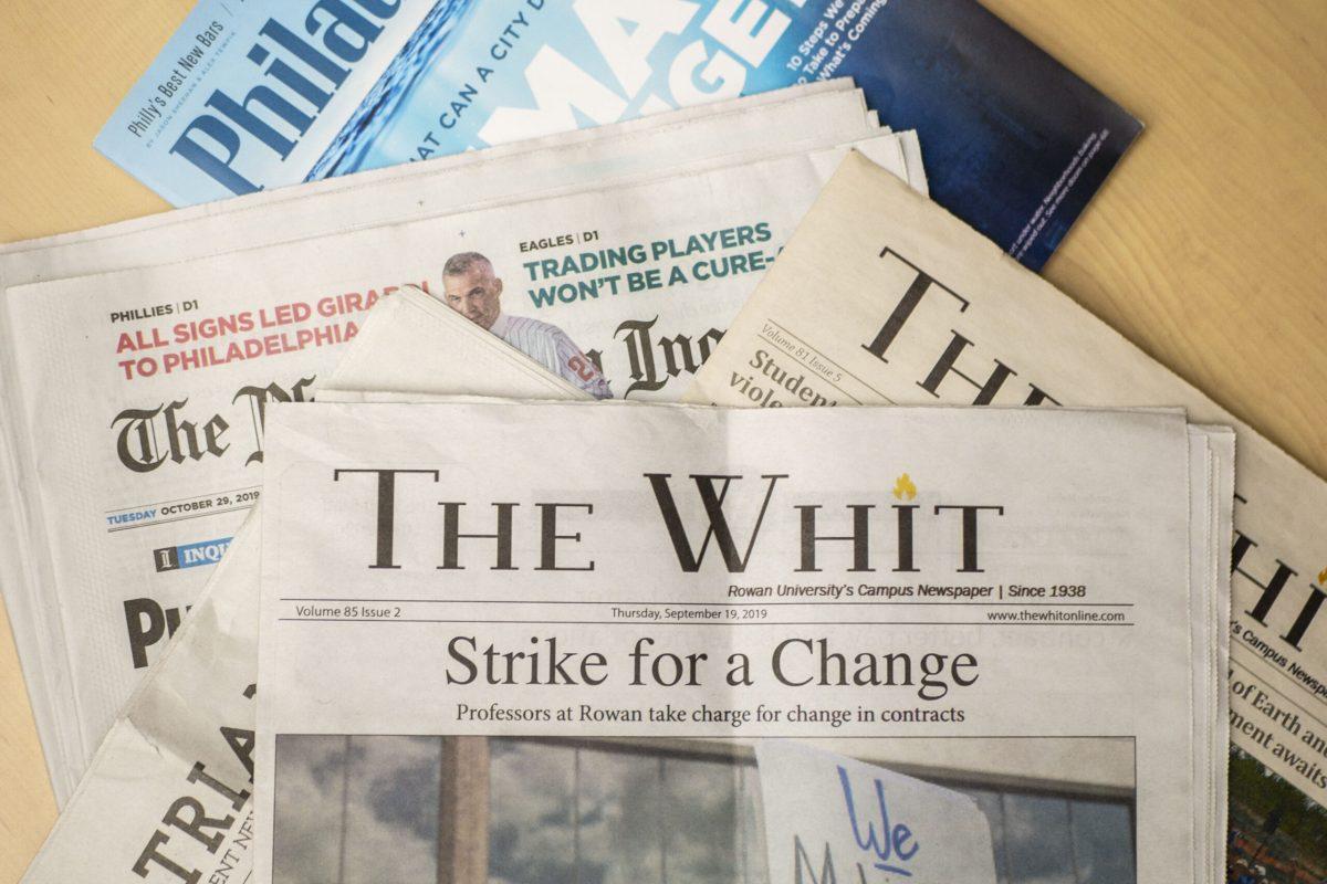 A copy of The Whit sits on a stack of newspapers. - Editor-in-Chief / Miguel Martinez