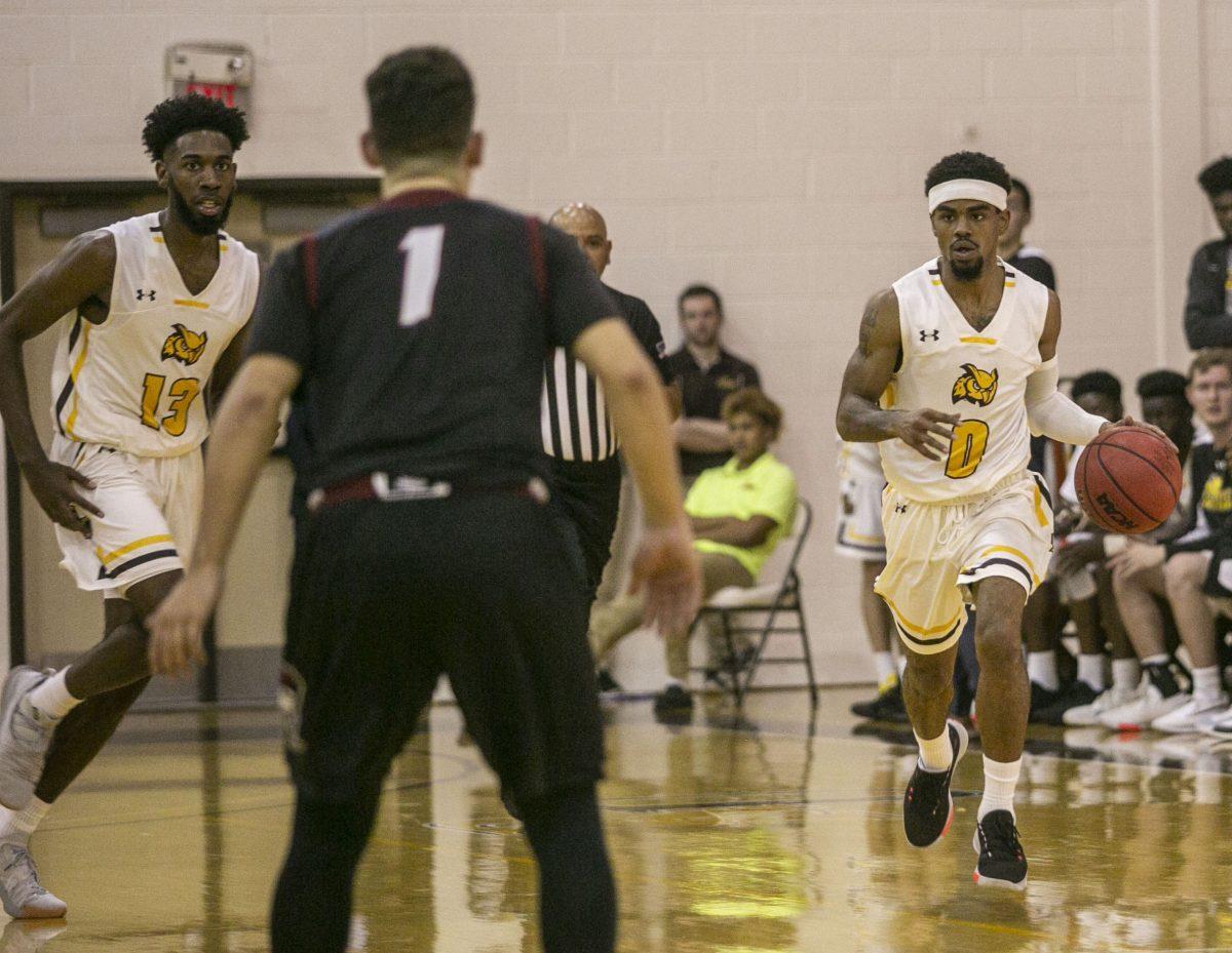 Maliq Sander (left) and Jerry Price (right) in a game earlier this season. Photo/ Editor in Chief Miguel Martinez.