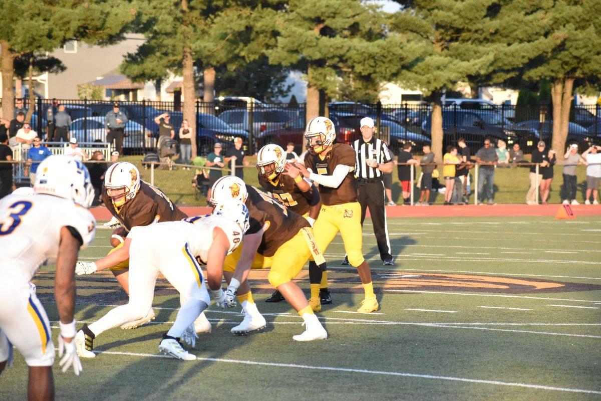 Mike Husni under center during a game earlier this year. Photo/ Christian A Browne.