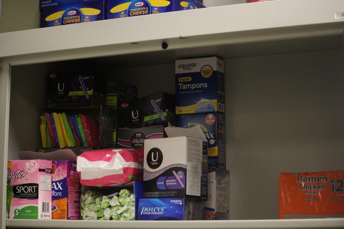 Room 317 of the new engineering building has a cabinet with half a shelf left of tampons and pads, as well as food for students who have trouble affording meals. Menstrual items, as well as food, are crucial for students' success. - Staff Writer / Kristin Guglietti