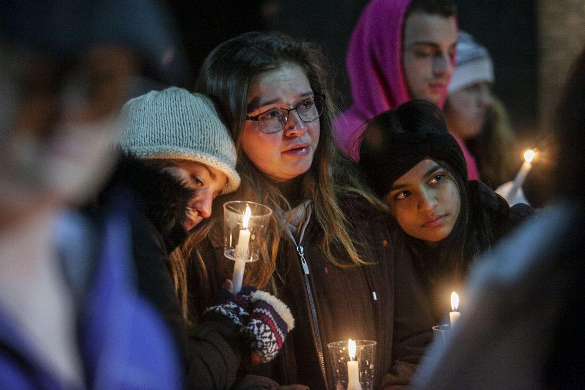 Rowan students grieve during a vigil at the Student Center back patio on Friday, December 6, 2019. Editor-in-Chief / Miguel Martinez