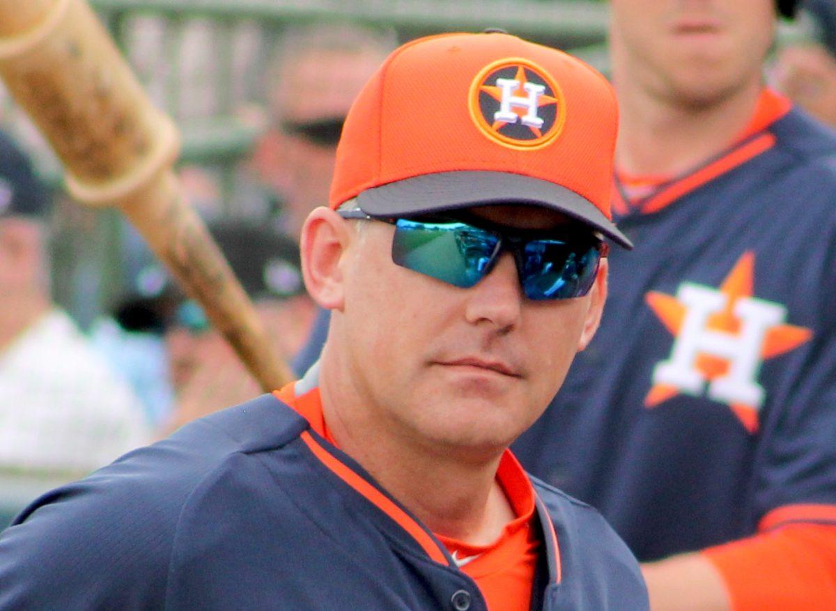 AJ Hinch in the Astros' dugout in Spring of 2015. Hinch was suspended by the MLB and subsequently fired by the Astros in the wake of the cheating scandal. - Eric Enfermero / Wikimedia Commons.