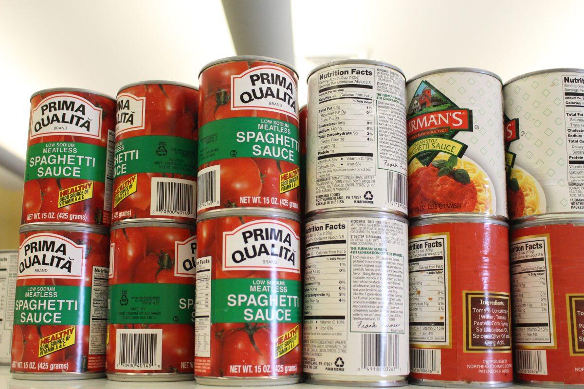 This semester, SGA is implementing a program to pay off parking tickets with donations to The SHOP. Cans of spaghetti sauce are just one of many items students can donate. - Assistant A&E Editor / Kristin Guglietti