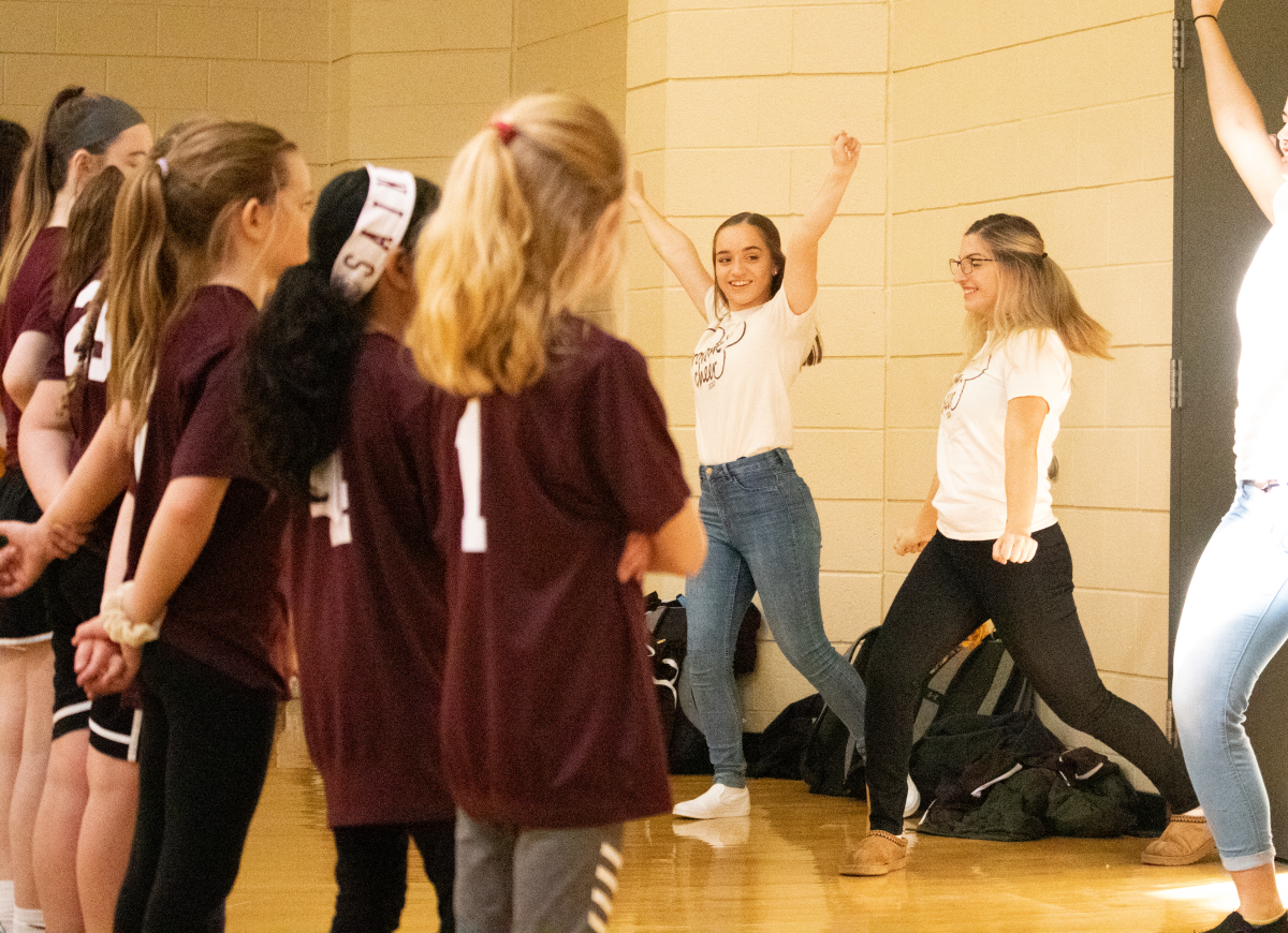 Rowan Cheer demonstrates a routine for a crowd of girls at the Lead Her Forward clinic at Rowan University. The team showed girls routines and skills as part of the clinic. Saturday, Feb. 8, 2020. Sports Editor / Vince Scian.