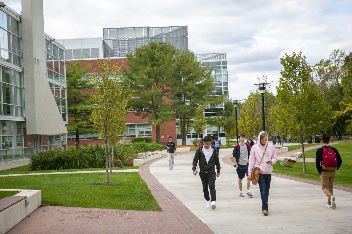 Students walking at Rowan University in Glassboro. Like students, professors and academic advisers are adjusting to the "new normal." - Photo / Miguel Martinez 