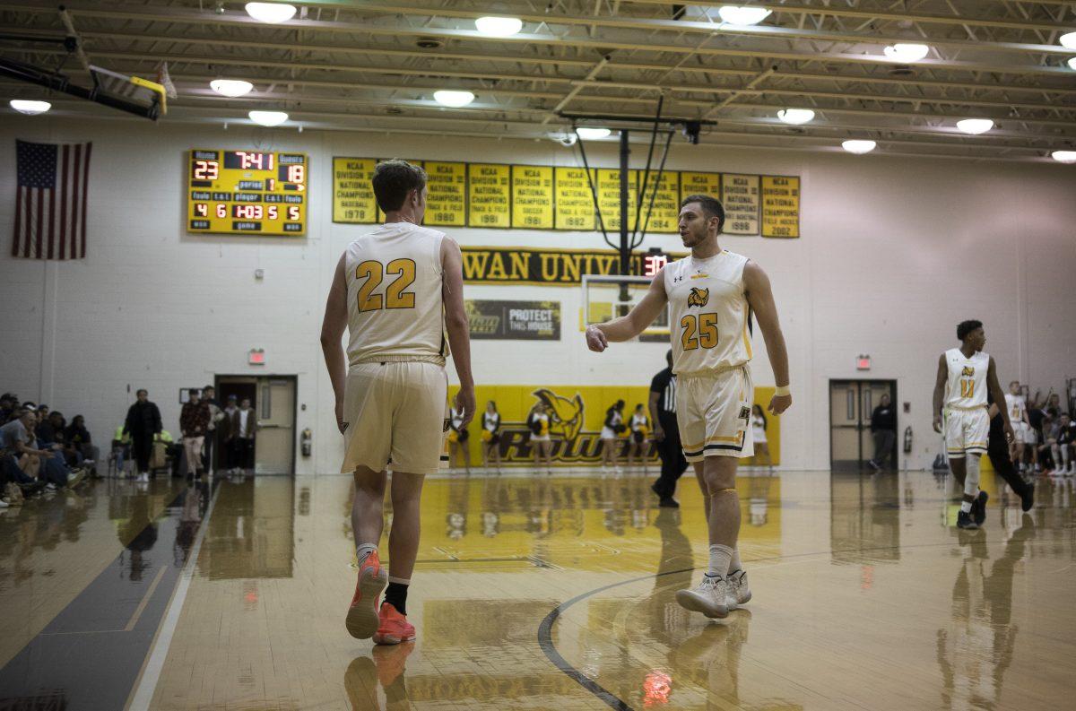 Seniors Brian Thatcher (left) and Austin Kearney talk after a play in a game against TCNJ. Jan 29th, 2020. Staff Photographer / Ben Stephens.