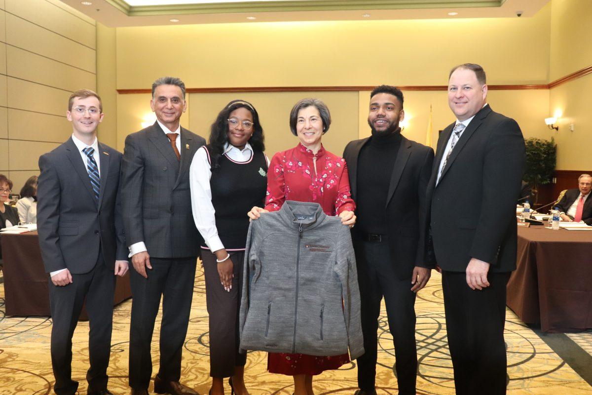 Jean Edelman and university officials unveil the newly named Ric Edelman College of Communication & Creative Arts - Dyone Payne / Multimedia Editor