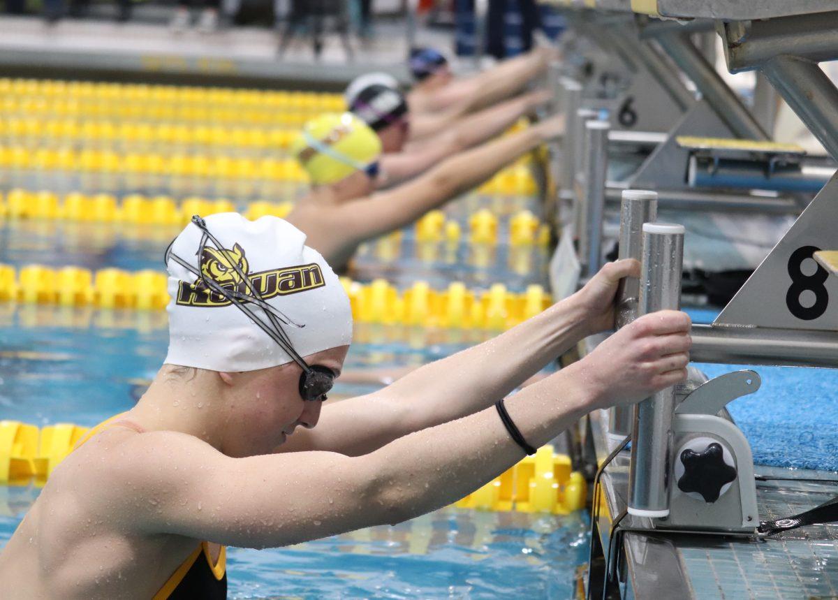 Rowan and USMMA swimmers prepare for the 100 backstroke. Abigail Brous took first in the race and Rowan won the meet 238-62. Saturday, Feb. 1, 2020. Multimedia Editor / Dyone Payne.