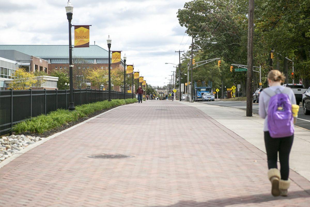 A student walking on campus. Due to COVID-19 restrictions, there have been less students walking on campus than we normally see. - File Photo / Miguel Martinez