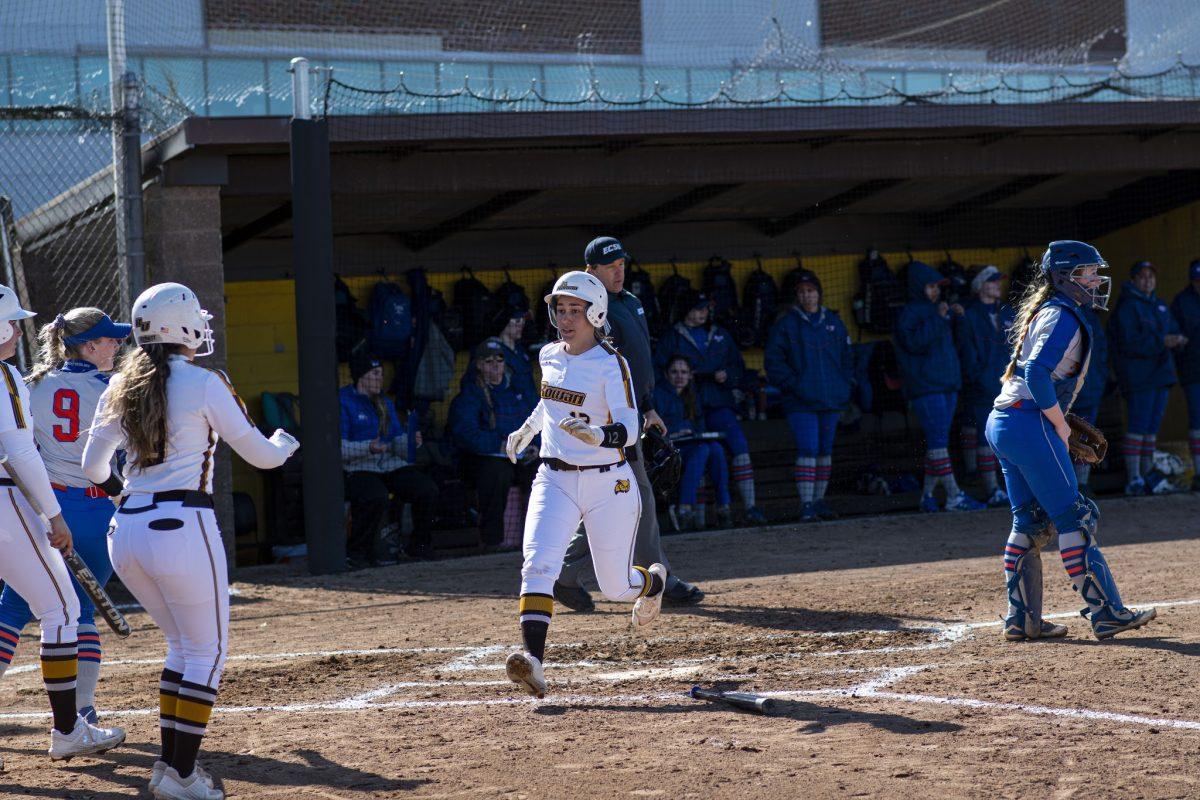 Senior outfielder / pitcher Jesse DeDomenico scores a run in the double header against New Paltz. DeDomenico was 4-6 on the day. Saturday, March 7, 2020. - Staff Photographer / Benjamin Stephens 