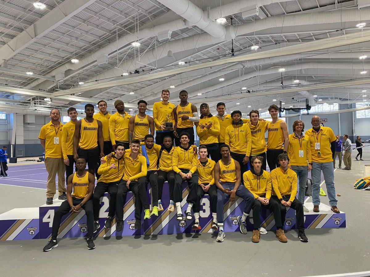 Men's Track & Field team poses with the All-Atlantic Regional Championship trophy. Saturday, March 7, 2020. - Photo / Rowan Athletics.