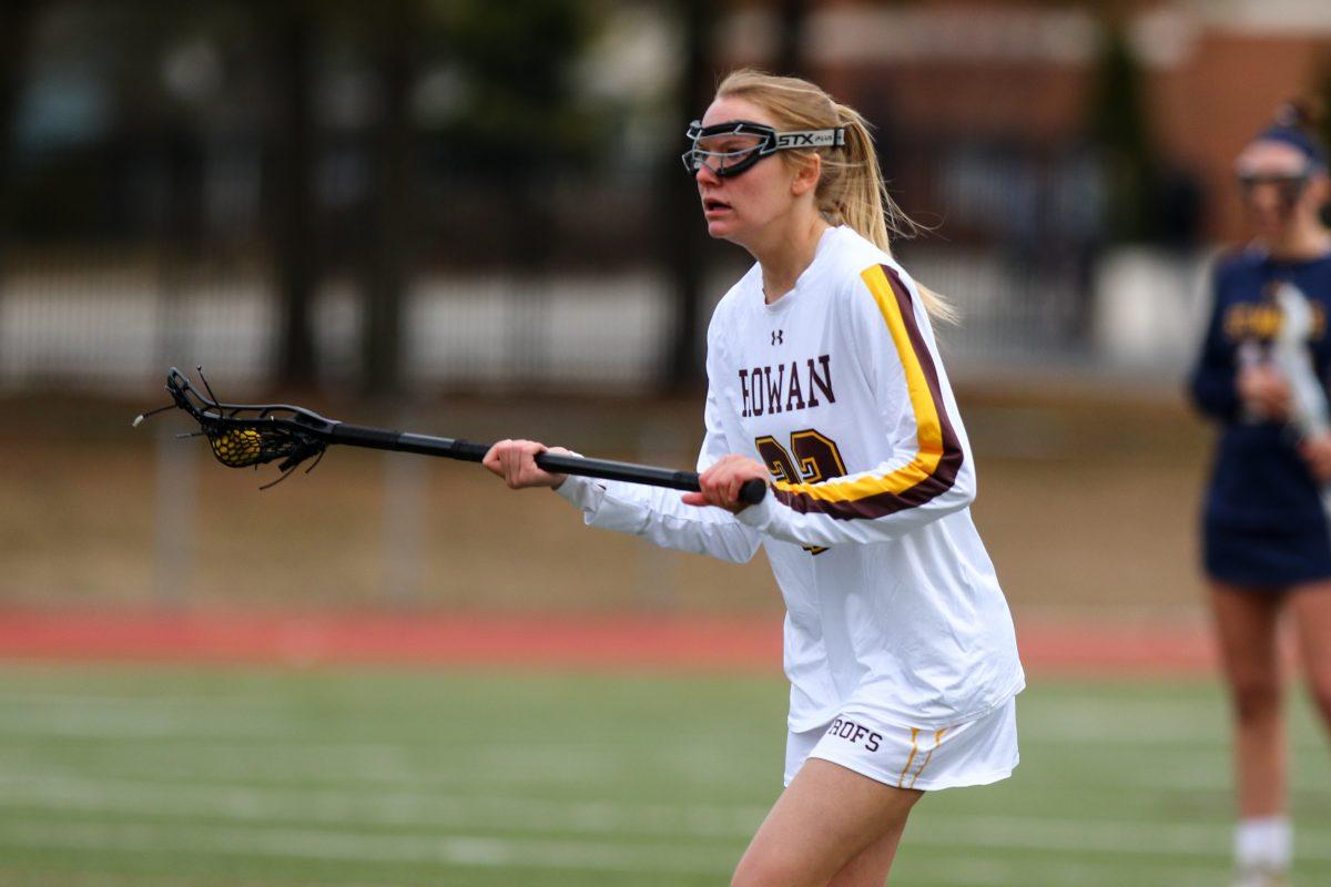 Julia Stumpf cradles the ball. She is returning after an injury plagued junior season. - Photo / Rowan Athletics.