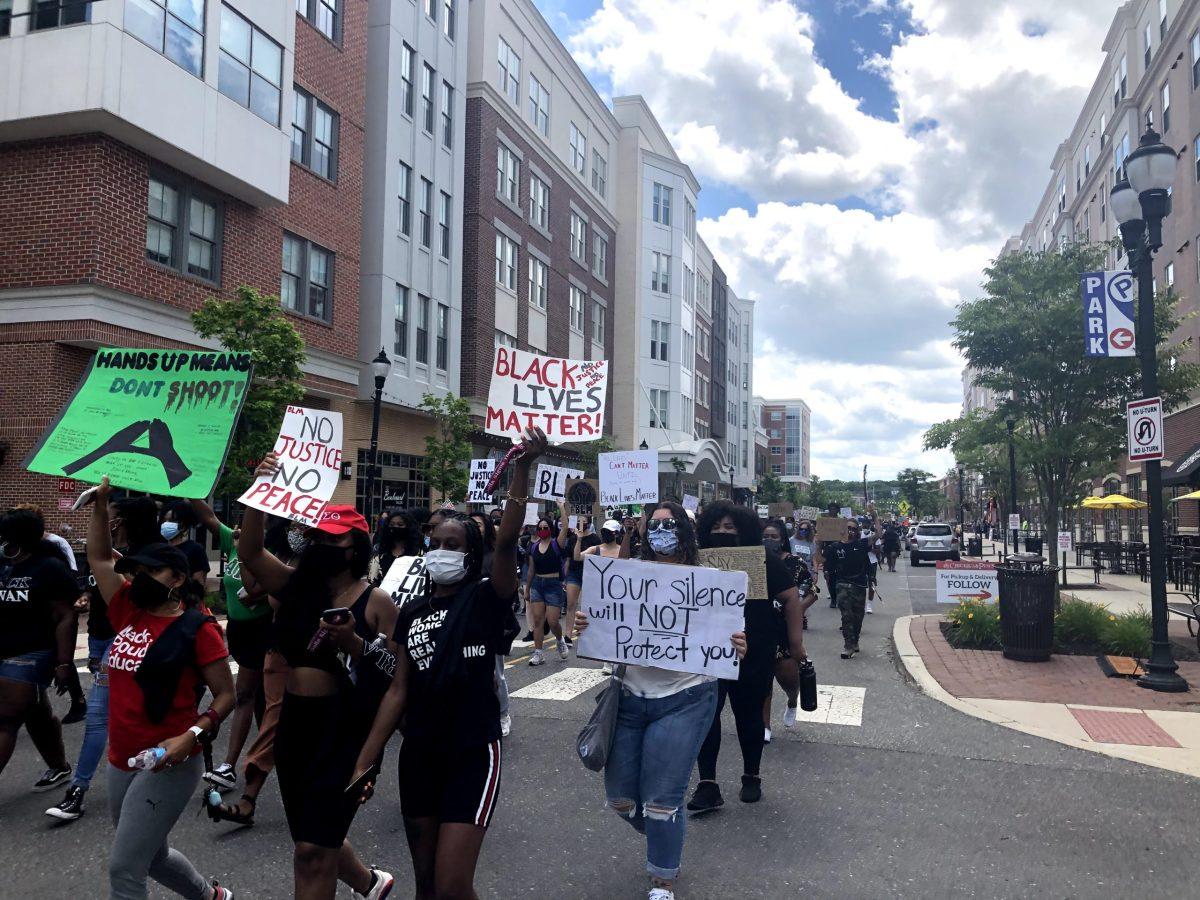 Rowan community members march down Rowan Boulevard in solidarity with the Black Lives Matter movement on Juneteenth 2020. - Editor-in-Chief / Kalie VanDewater