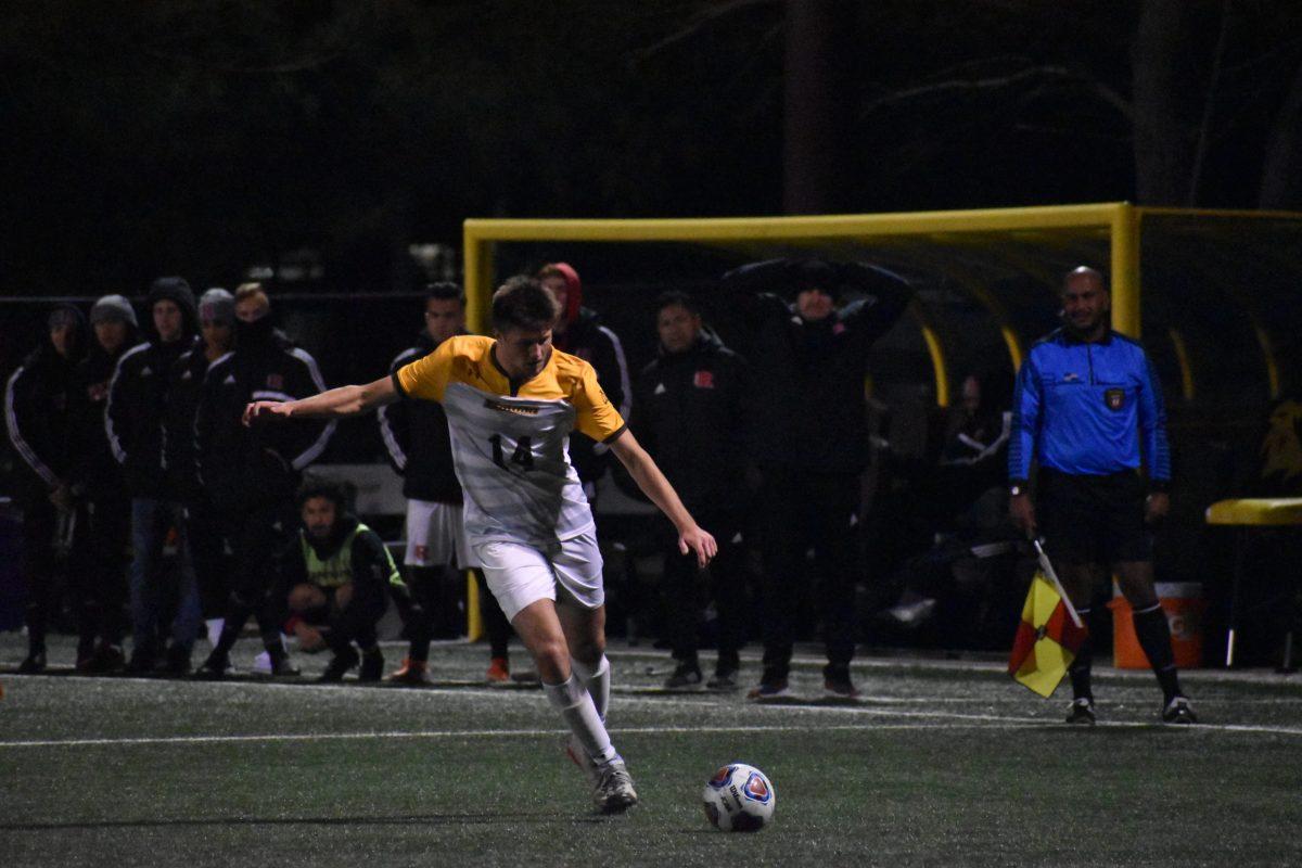 Matt Fahey takes a free kick against Rutgers-Newark last season. Photo / Christian Browne 