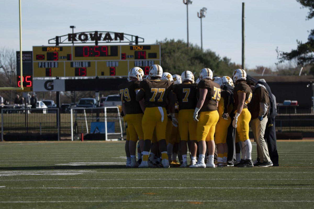 Rowan's football team in a huddle during a game last season against TCNJ. The Profs went on to win this game 24-20. -Staff Photographer / Ben Stephens 