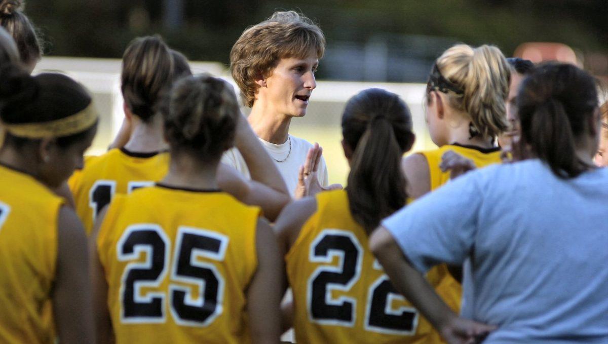 Former field hockey head coach and current Associate Athletic Director Penny Kempf speaks to the team during a game. - Photo / Rowan Athletics 