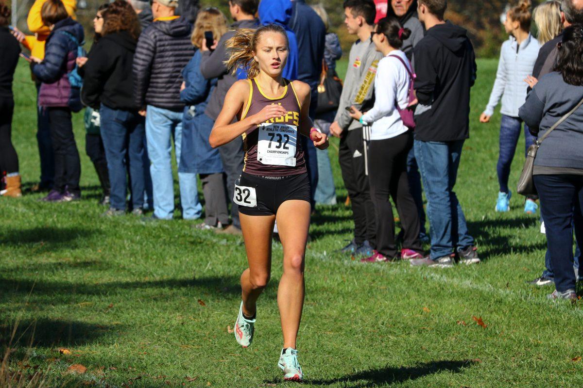 Cross-country runner Alyssa Sanders finishes up a race. Sanders was named one of the team captains for this season. - Photo / Rowan Athletics 