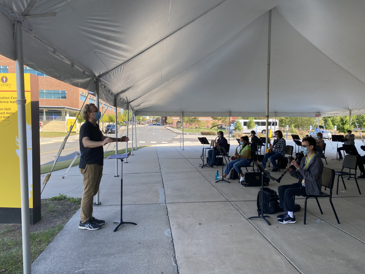 Director of Bands Joseph Higgins conducts a COVID-19-adapted band. Many adjustments to practices were made to make them as safe as possible. - Contributor / Craig Storm