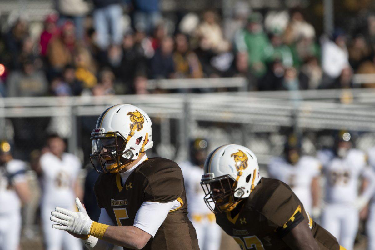 Running back Messiah Divine and quarterback Mike Husni line up before a snap. Divine, Husni and the rest of the team have returned to practicing with new COVID-19 precautious. - Photo / Ben Stephens  