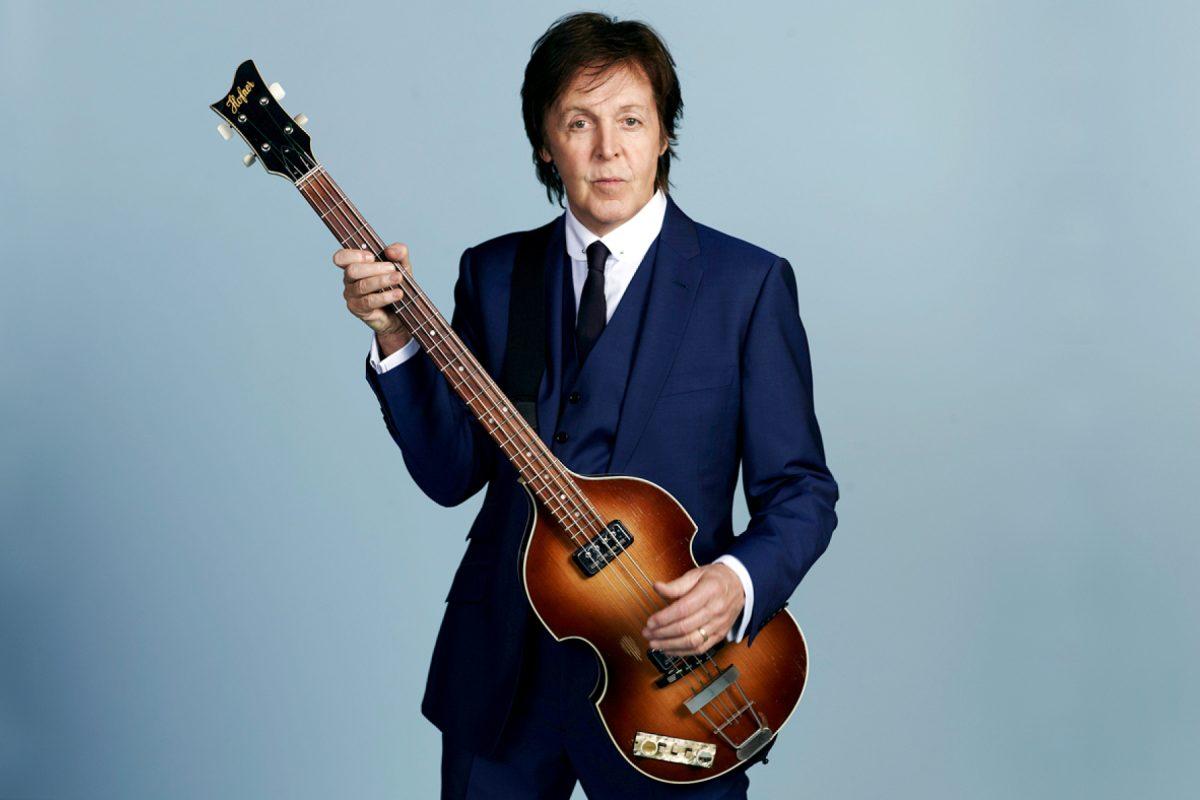 Paul McCartney poses with his left-handed bass guitar. This December, the Beatles legend will release his third self-titled album to complete a trilogy. - Photo via Rolling Stone