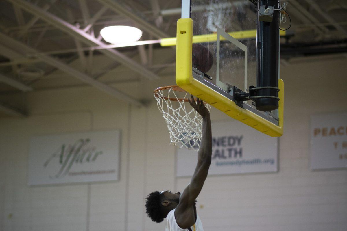 A Rowan Men's Basketball player jumping up to the rim during a game last season. The team is hoping to build off their last season when their next season does begin. - File Photo / Ben Stephens 