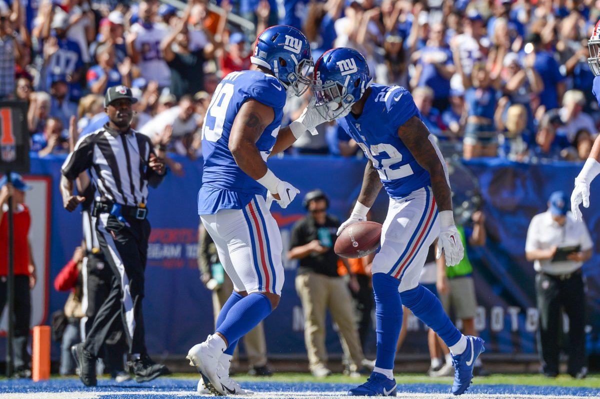 Giants players Wayne Gallman and Elijhaa Penny during a game last season. Gallman had a touchdown in the team's win over the Bengals this week. Photo / flickr user All-Pro-Reels 