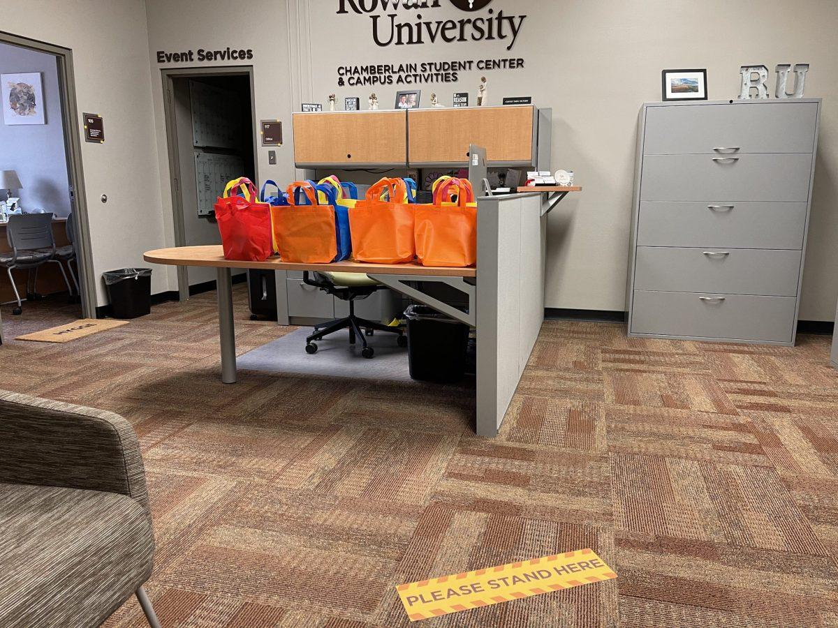 Art kit bags are lined up and ready for pick-up at the Chamberlain Student Center for the Virtual Canvas Painting event. - Photo / Gabrielle Giacomelli